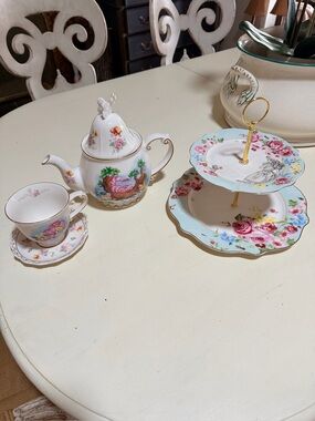 Disney Alice in wonderland tea pot cup and  saucer.